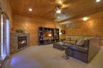 Den in the Lower Level with a Large Sectional Couch, Flat Scree TV and Gas-Log Fireplace 